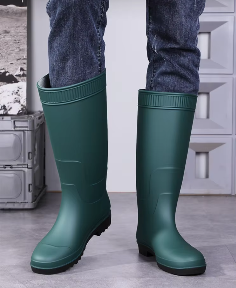 man-wearing-dark-green-knee-high-pvc-work-wellington-boots